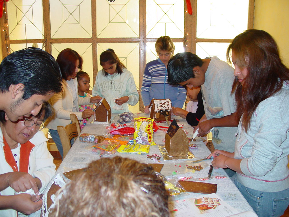 Group working on gingerbread houses