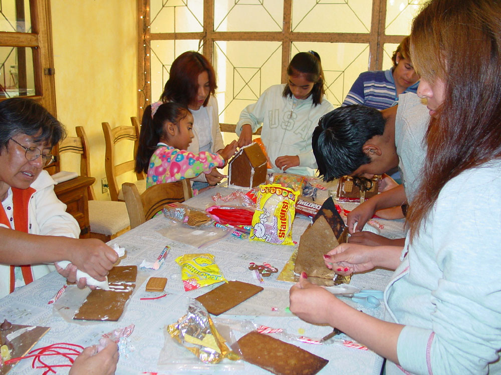 Group working on gingerbread houses.